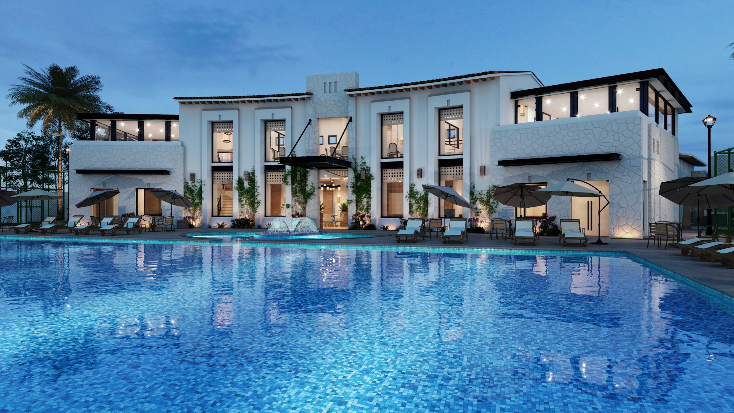 Hotel exterior and guest pool at dusk